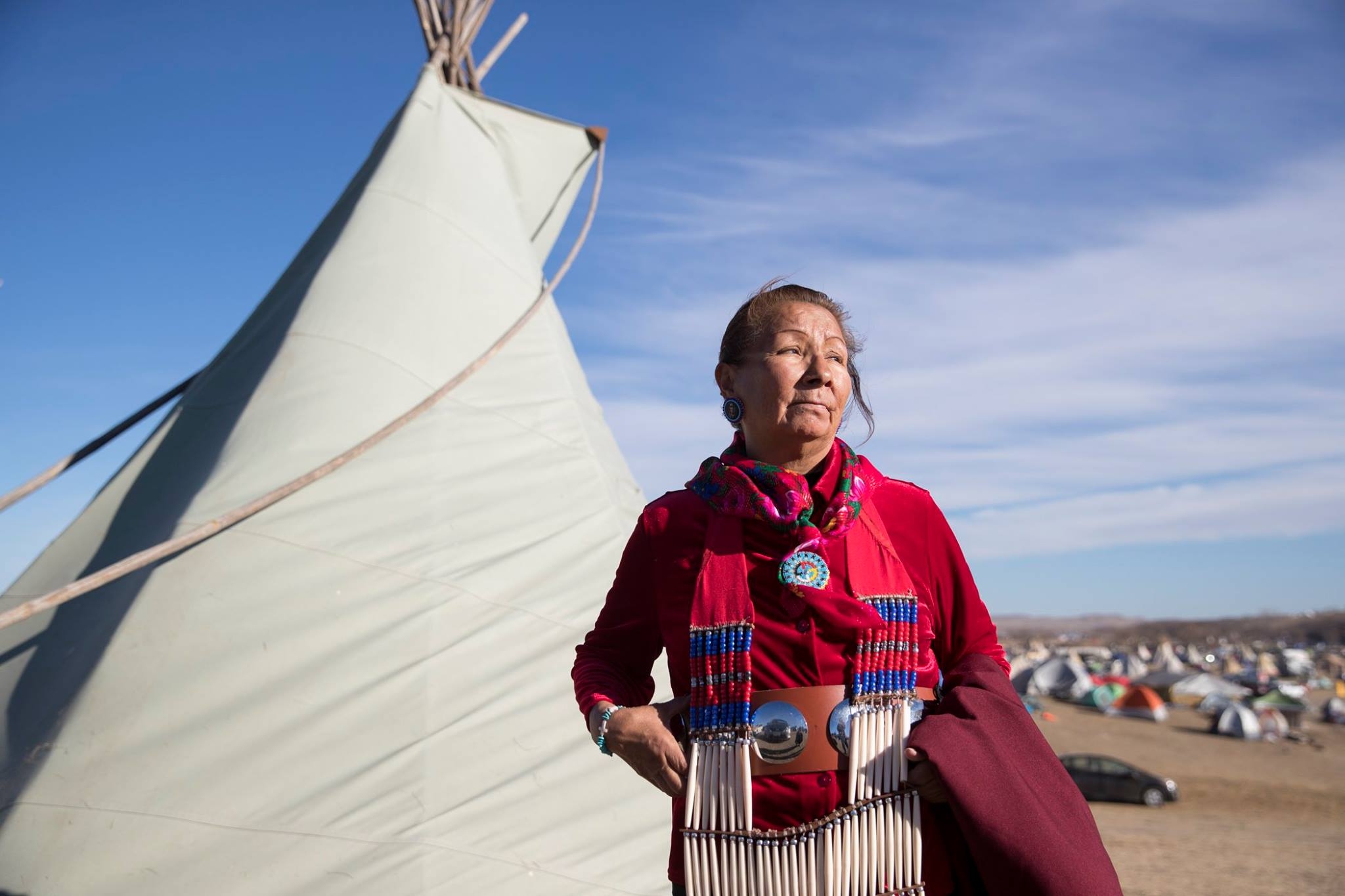 woman and tipi in standing rock protest camp